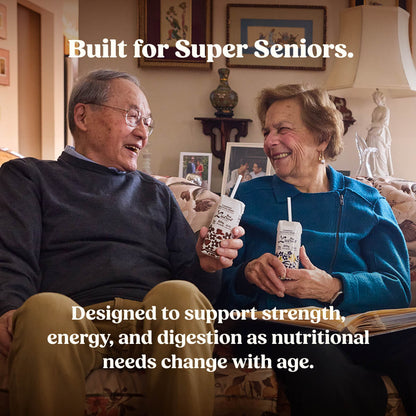 Two super seniors sitting together holding drinks with the text "Built for Super Seniors – Designed to support strength, energy, and digestion as nutritional needs change with age."
